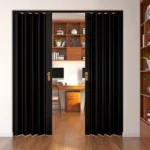 Black PVC folding door partially open to home office