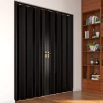 Closed black double folding door with gold handles
