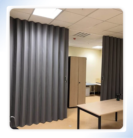 Grey PVC folding door in an office setting