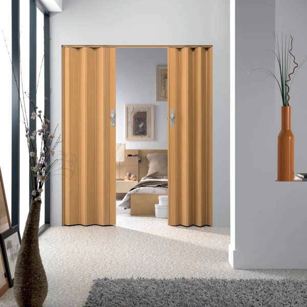 Light oak PVC accordion door leading to a bedroom.