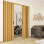 Light wood folding doors partially open in a living room