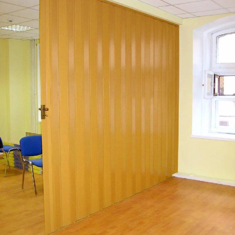 Light wood grain PVC folding door leading to a bedroom (1)