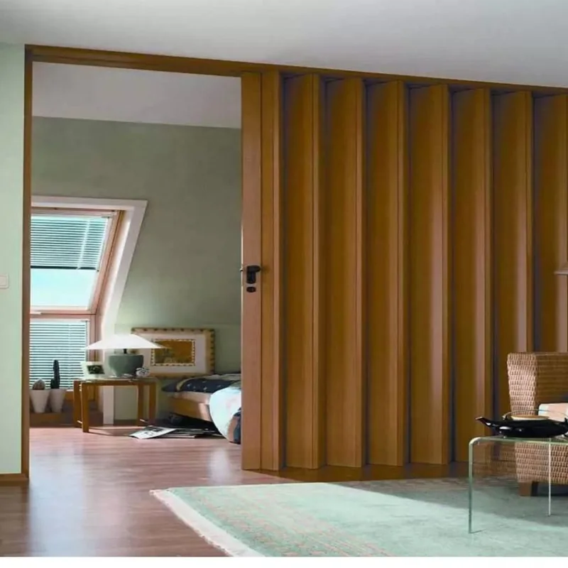 Light wood grain PVC folding door leading to a bedroom